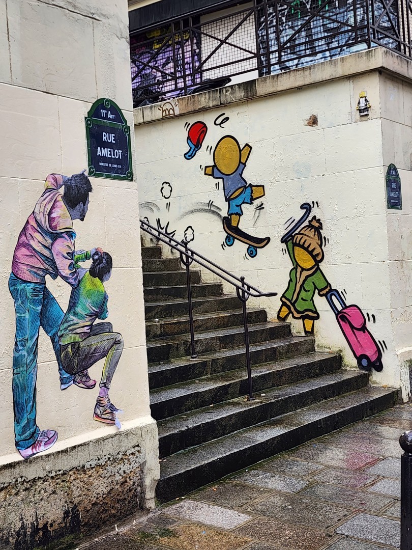 Down the stars 2 streetart paintings and glued paper.