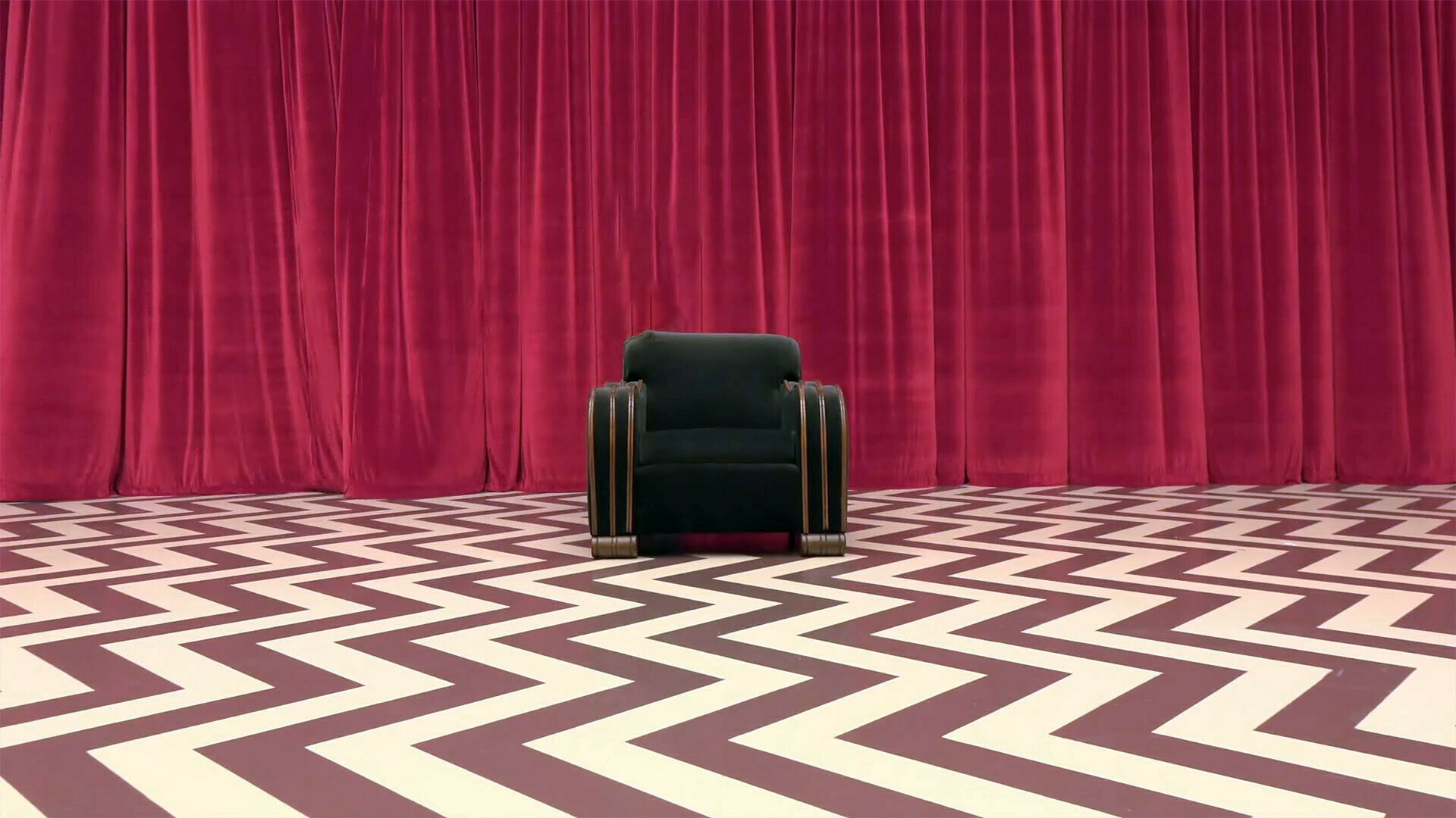 An empty chair in the red room